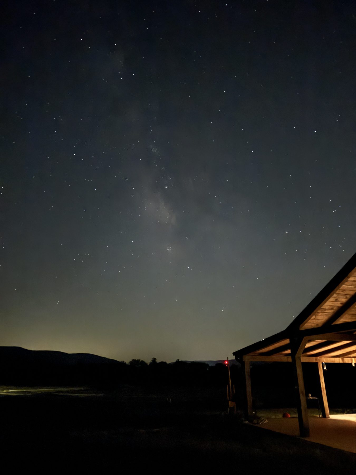 Night sky full of stars over the farm's covered pavilion